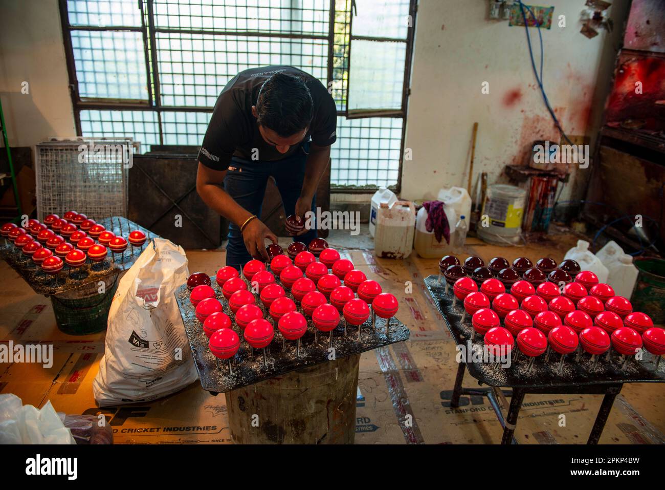 Meerut, India. 08th Apr, 2023. A man seen arranging pink cricket balls