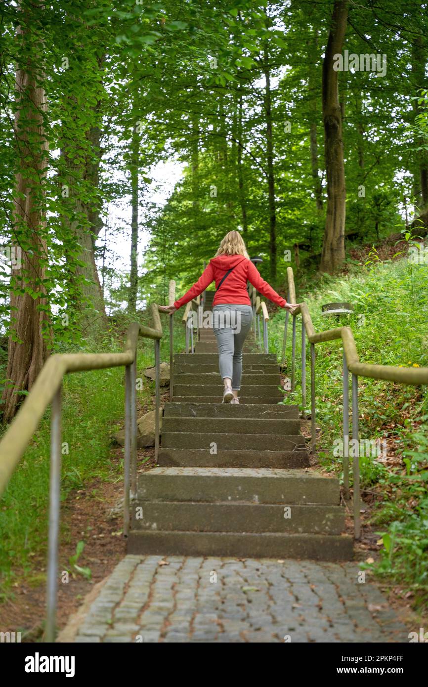 Black woman running up stairs hi-res stock photography and images - Alamy