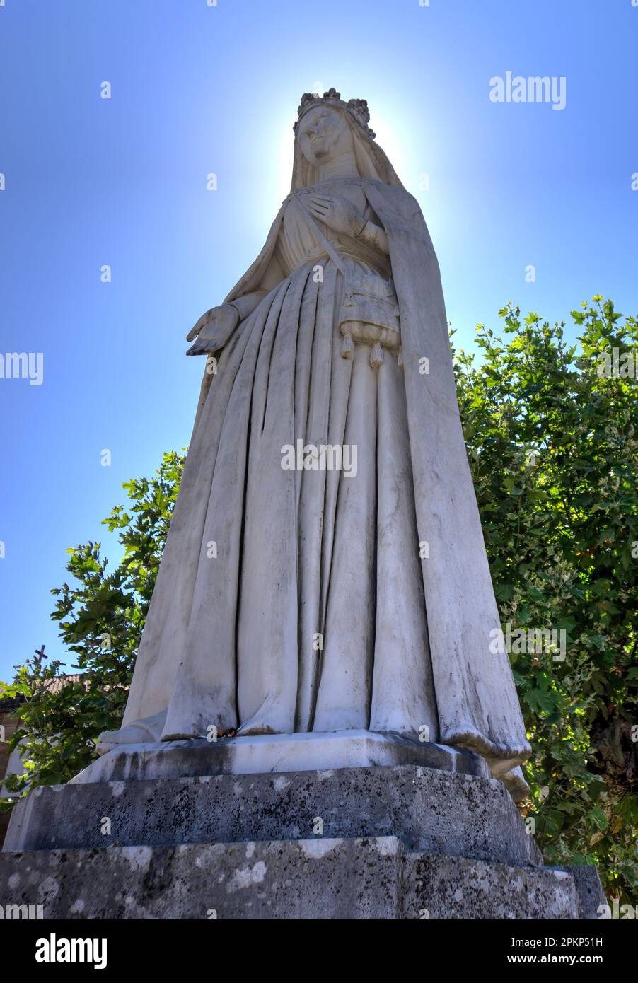 Coimbra, Portugal - August 15, 2022: Statue of Queen Saint Isabel outside Santa Clara-a-Nova Monastery Stock Photo