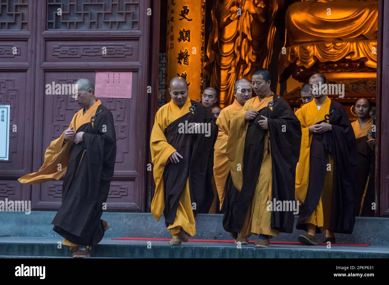 Devout monks leaving a temple, Lingying Monastery, Xihu, Hangzhou, Zhejiang Province, China, Asia Stock Photo