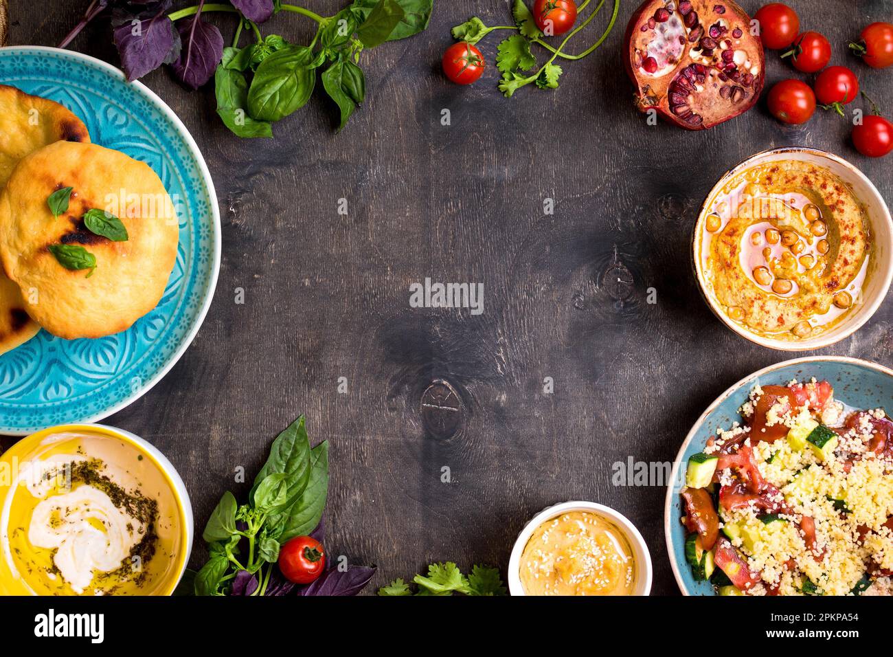 Table Served With Middle Eastern Traditional Vegetarian Dishes Hummus table-served-with-middle-eastern-traditional-vegetarian-dishes-hummus
