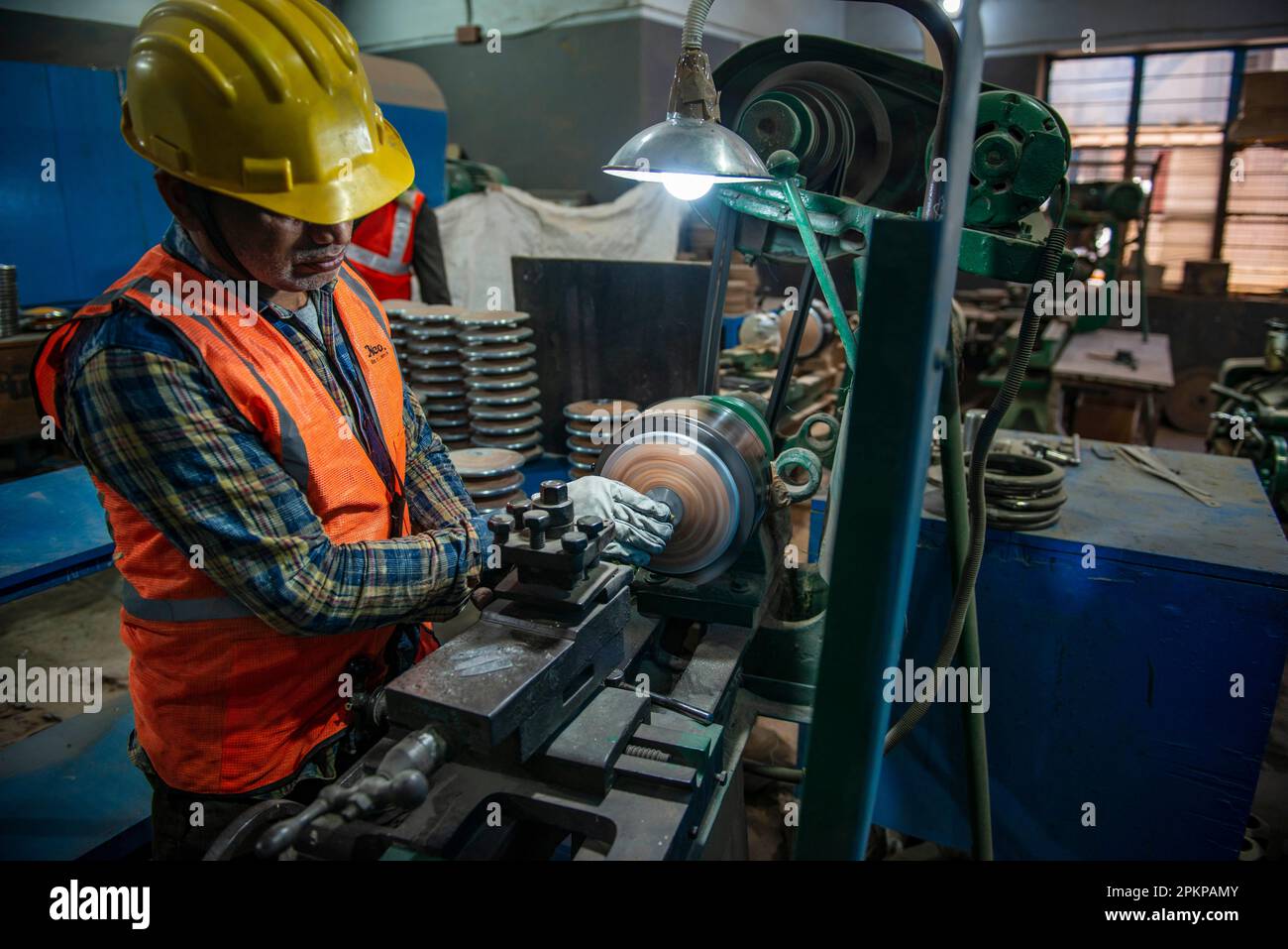 Meerut, India. 08th Apr, 2023. A worker seen shaping wooden discus disc