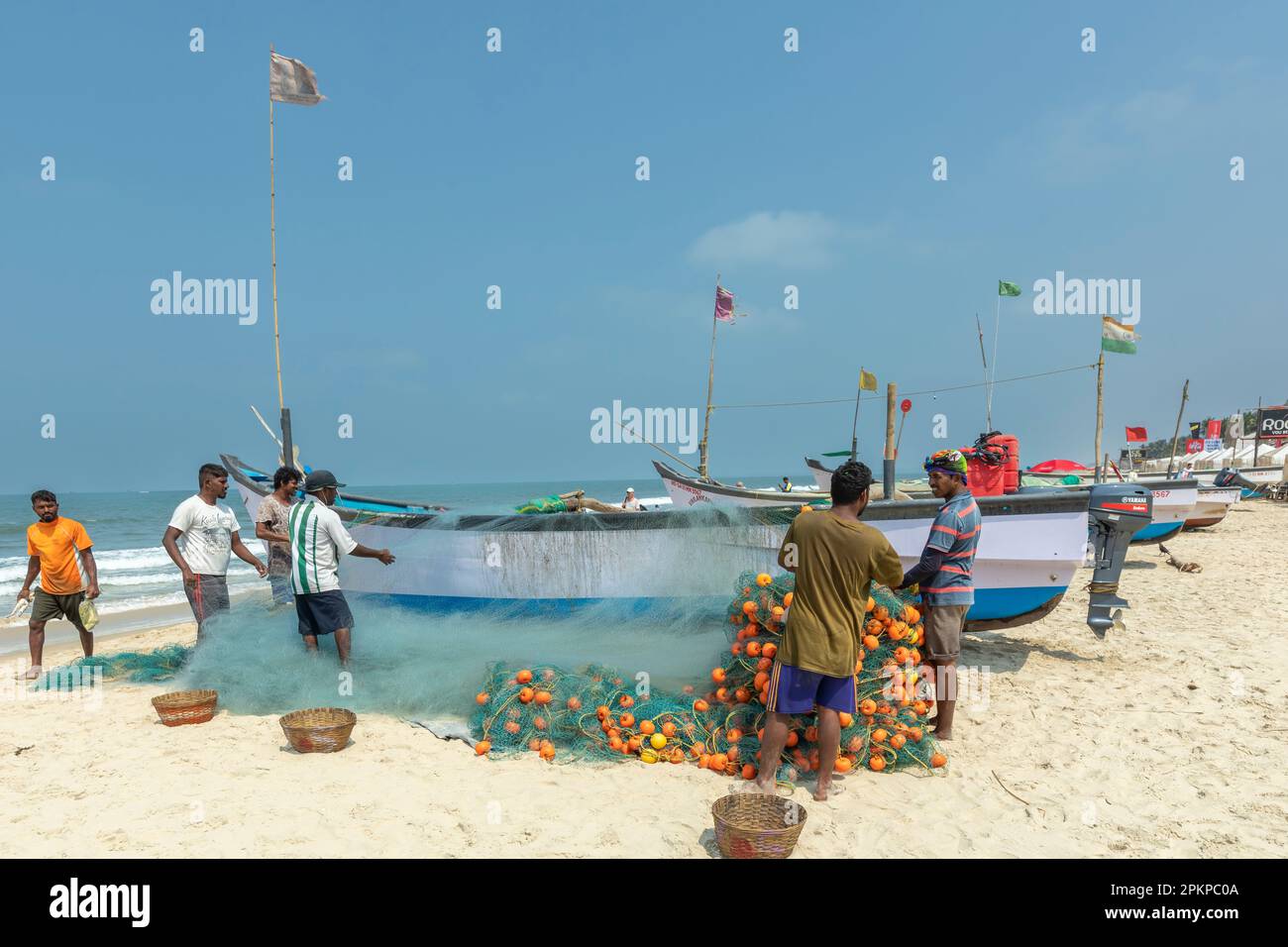 Benaulim Beach, Goa India. April, 06 2023. Fishermen unloading their catch from strawllers