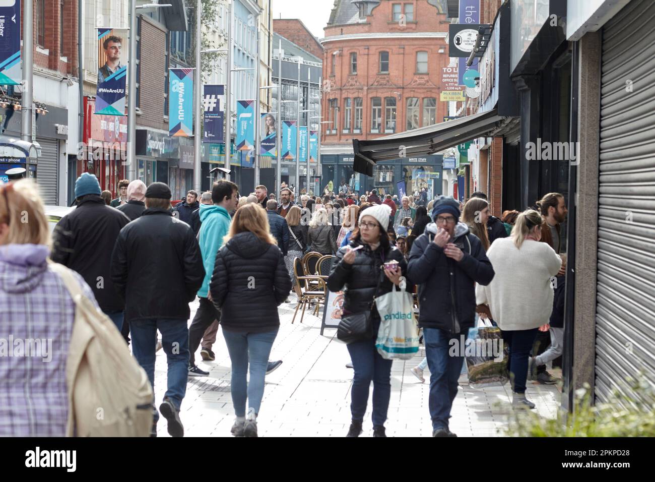 busy ann street on a saturday evening with shoppers in pedestrian area of Belfast City Centre, Northern Ireland, UK Stock Photo