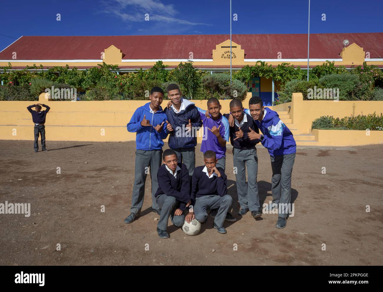 School boys pose in front of the Zoar R.P. Botha VGR School. Stock Photo