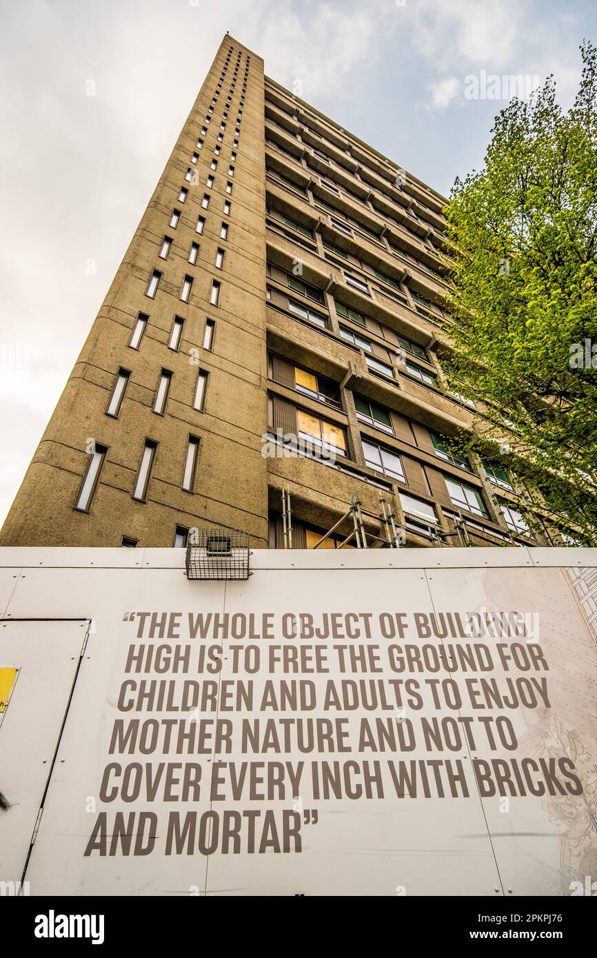 Balfron Tower with Erno Goldfinger billboard, classic brutalist architecture, social housing has been redeveloped into luxury flats. Social Cleansing. Stock Photo