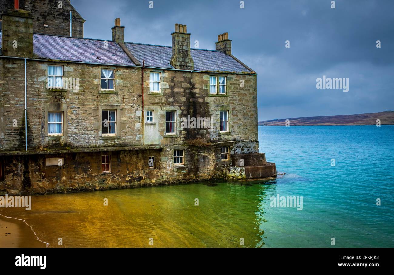 House built right at the waters edge in Lerwick, Shetland Islands