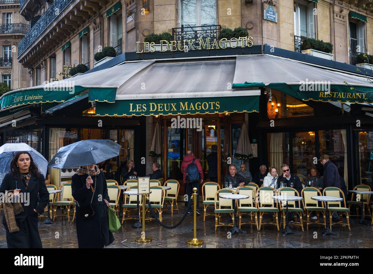 Les Deux Magots, the famous cafe and restaurant in Paris, France on a rainy day. March 24, 2023. Stock Photo