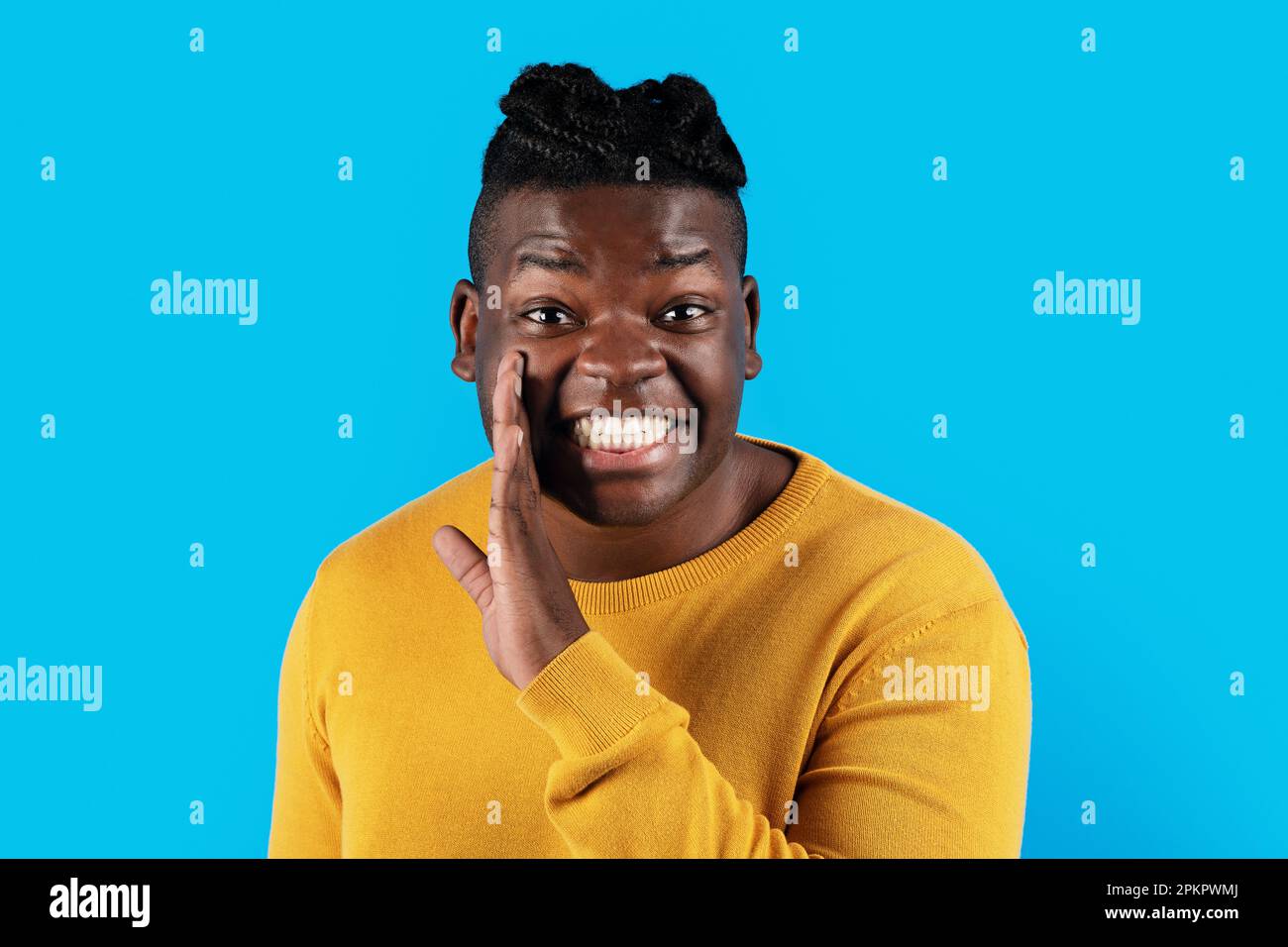 Black guy sharing rumor with his excited girlfriend Stock Photo - Alamy