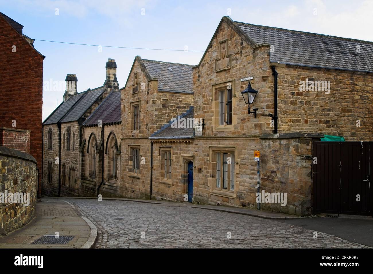 Old buildings line the cobbled street of Owengate in Durham City centre