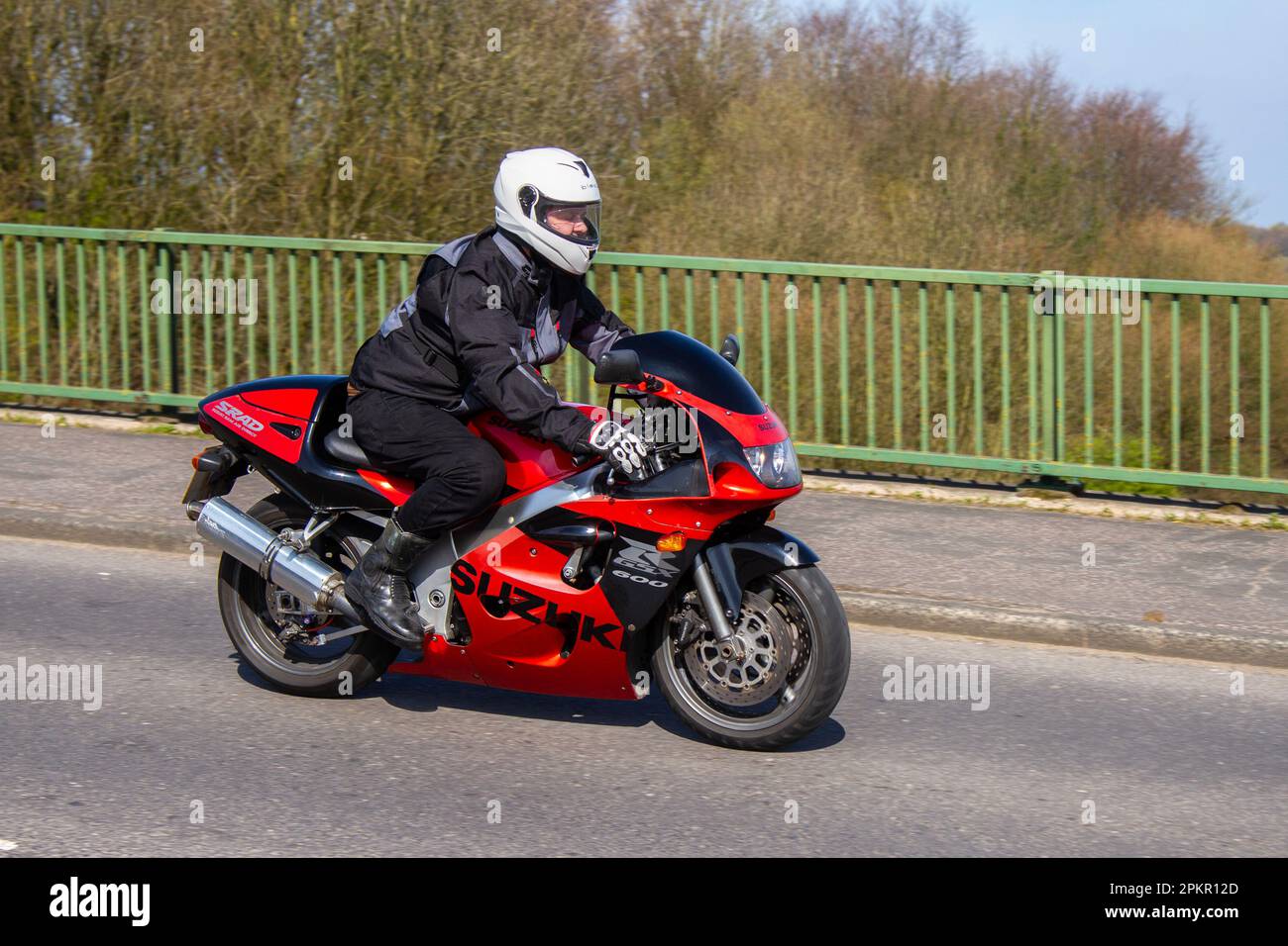 1999 90s nineties Red Suzuki Gsxr 600 W Inline Four Orange, Motorcycle Supersports Petrol 599 cc; crossing motorway bridge in Greater Manchester, UK Stock Photo