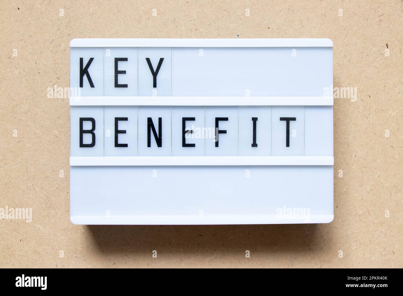 Lightbox with word key benefit on wood background Stock Photo