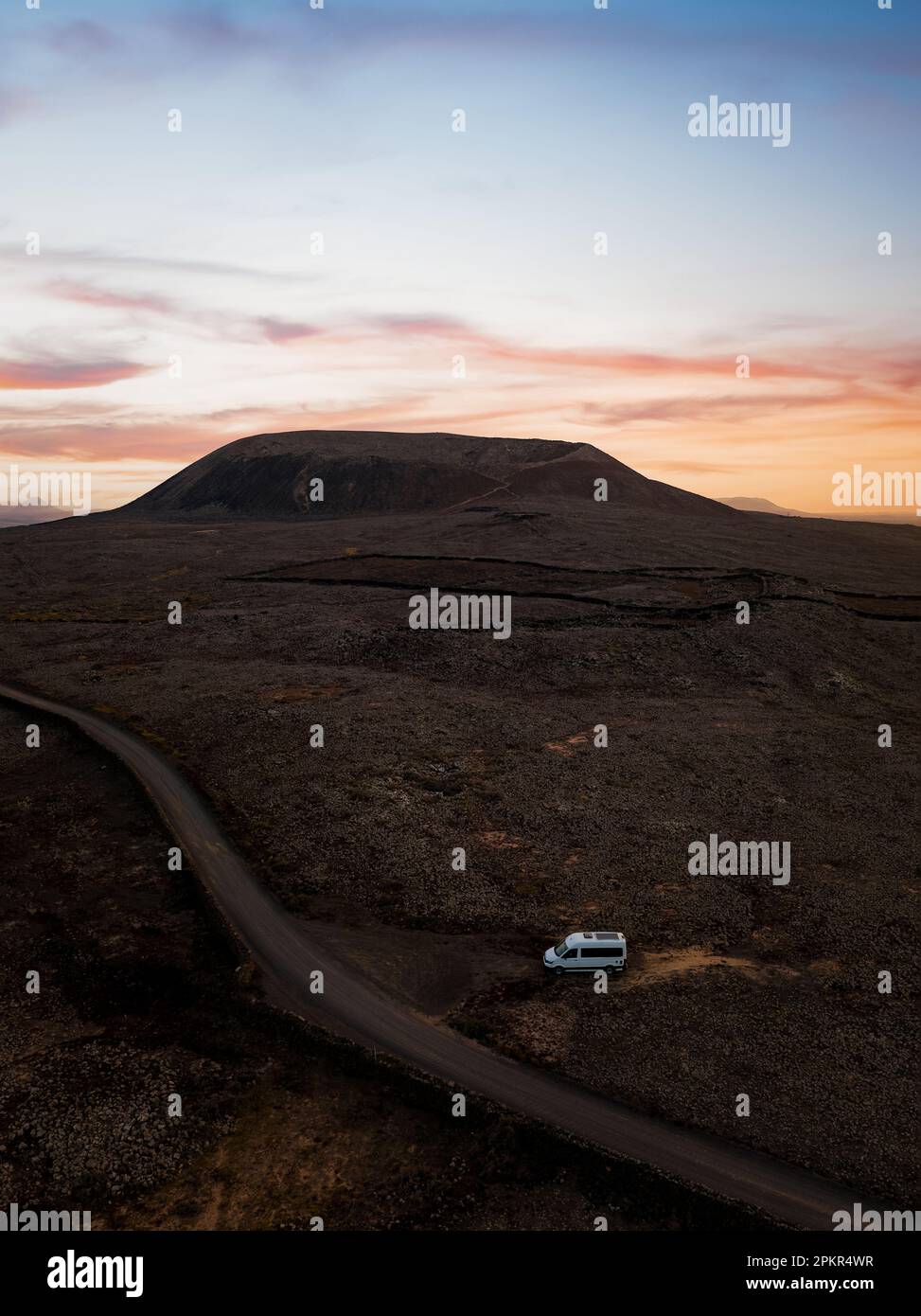 View from above, stunning aerial view of a van parked under the Calderon Hondo in Fuerteventura, Canary Islands Stock Photo