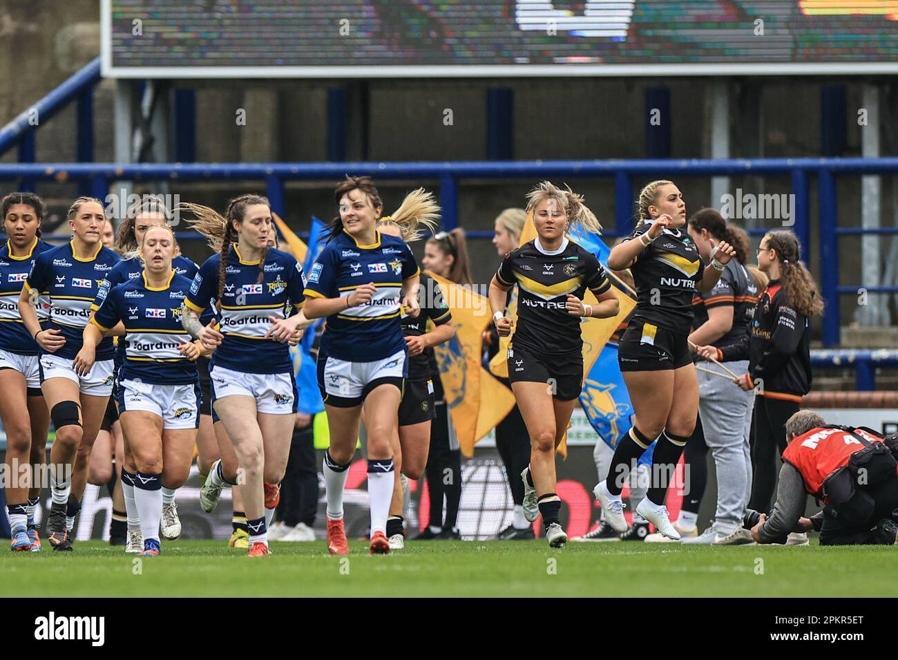 Hanna Butcher of Leeds Rhinos leads her team out during the Betfred Women's Super League match Leeds Rhinos vs York Valkyrie at Headingley Stadium, Leeds, United Kingdom, 9th April 2023  (Photo by Mark Cosgrove/News Images) Stock Photo