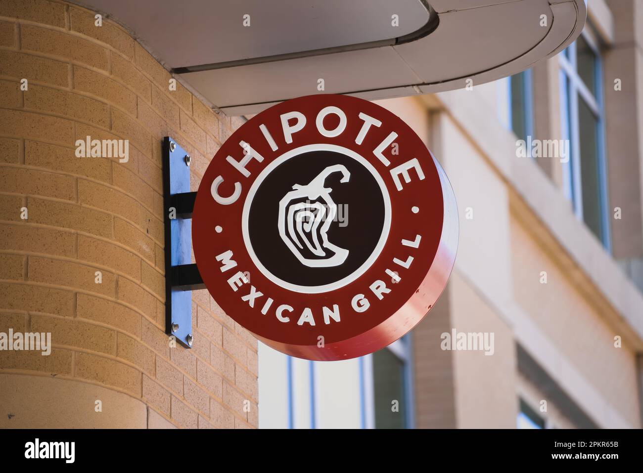 Arlington, VA - April 2, 2023 : Chipotle Mexican Grill circular round sign on popular street in Virginia. Stock Photo