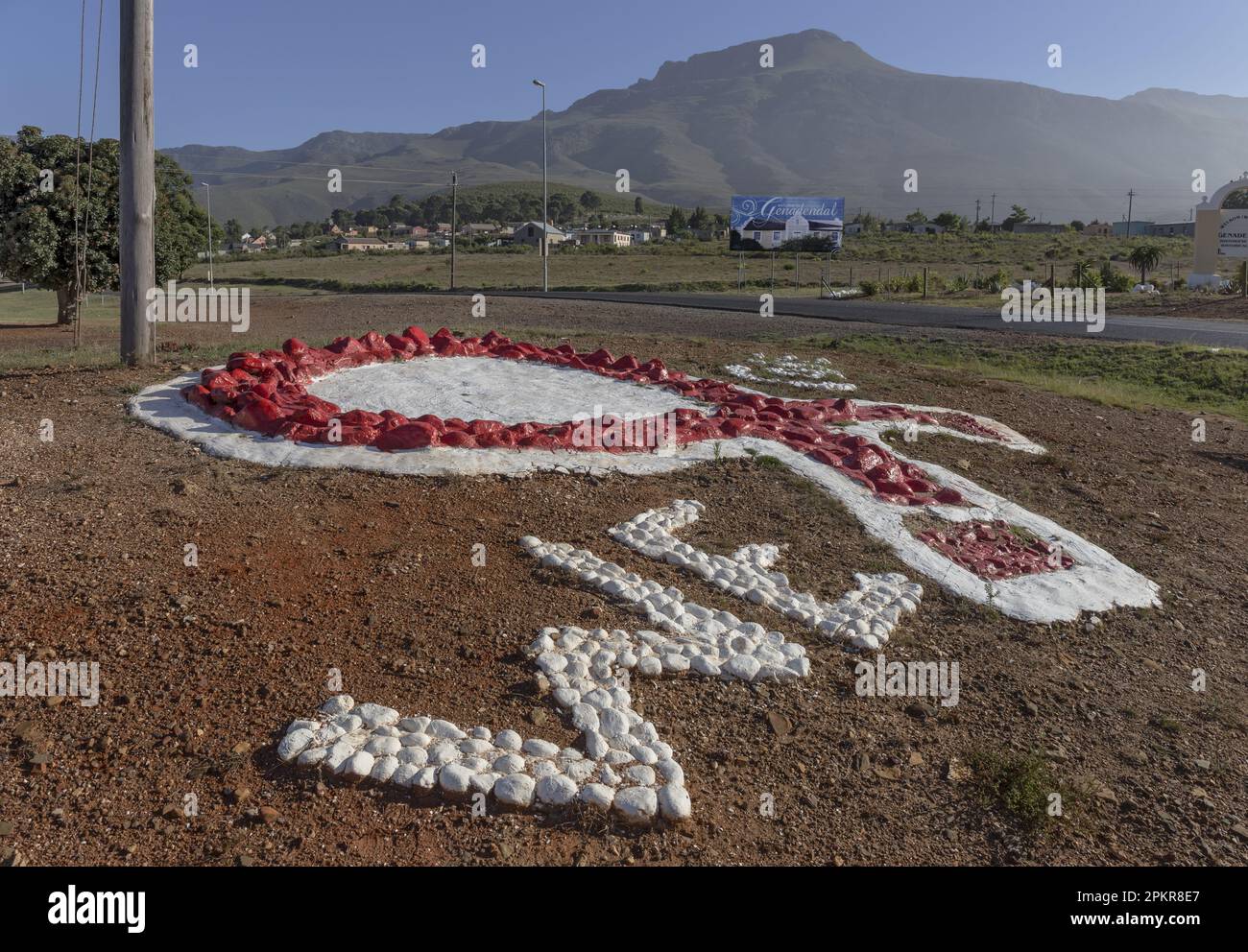 A large stone and cement anti-Aids emblem greets visitors to the ...