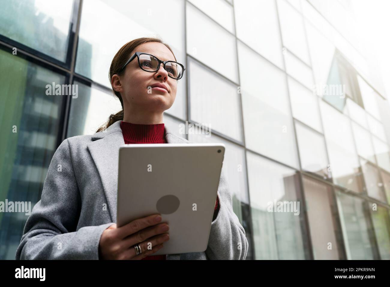 Portrait female entrepreneur with digital tablet in hands. Stock Photo