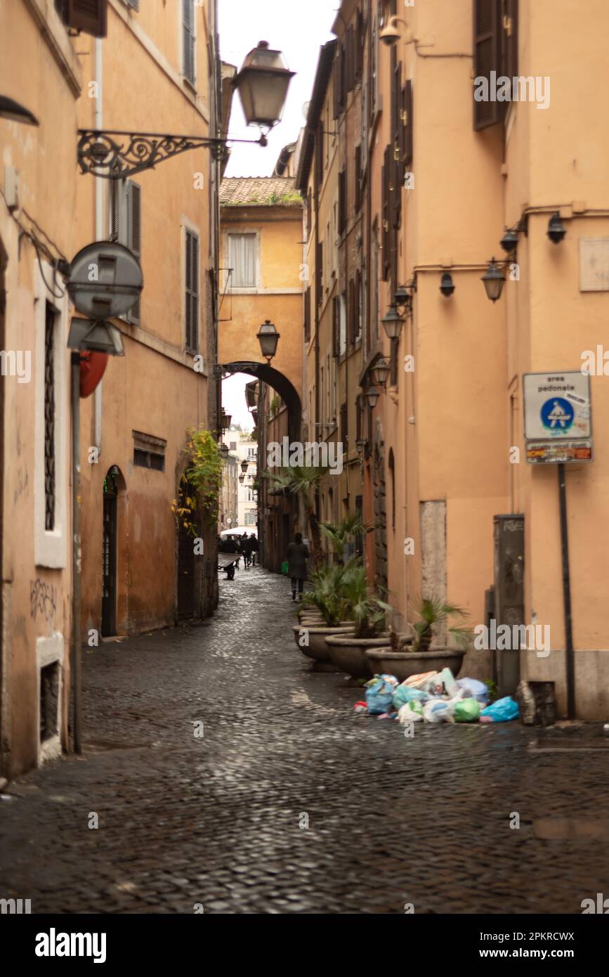 Alleyway in central Rome with abandoned bags of rubbish Stock Photo