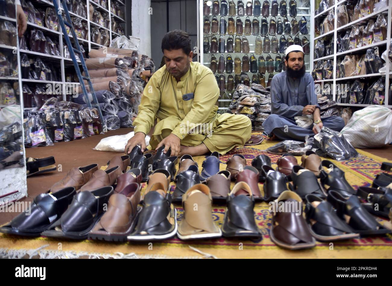 Peshawar, Pakistan. 9th Apr, 2023. Pakistani shoemakers show