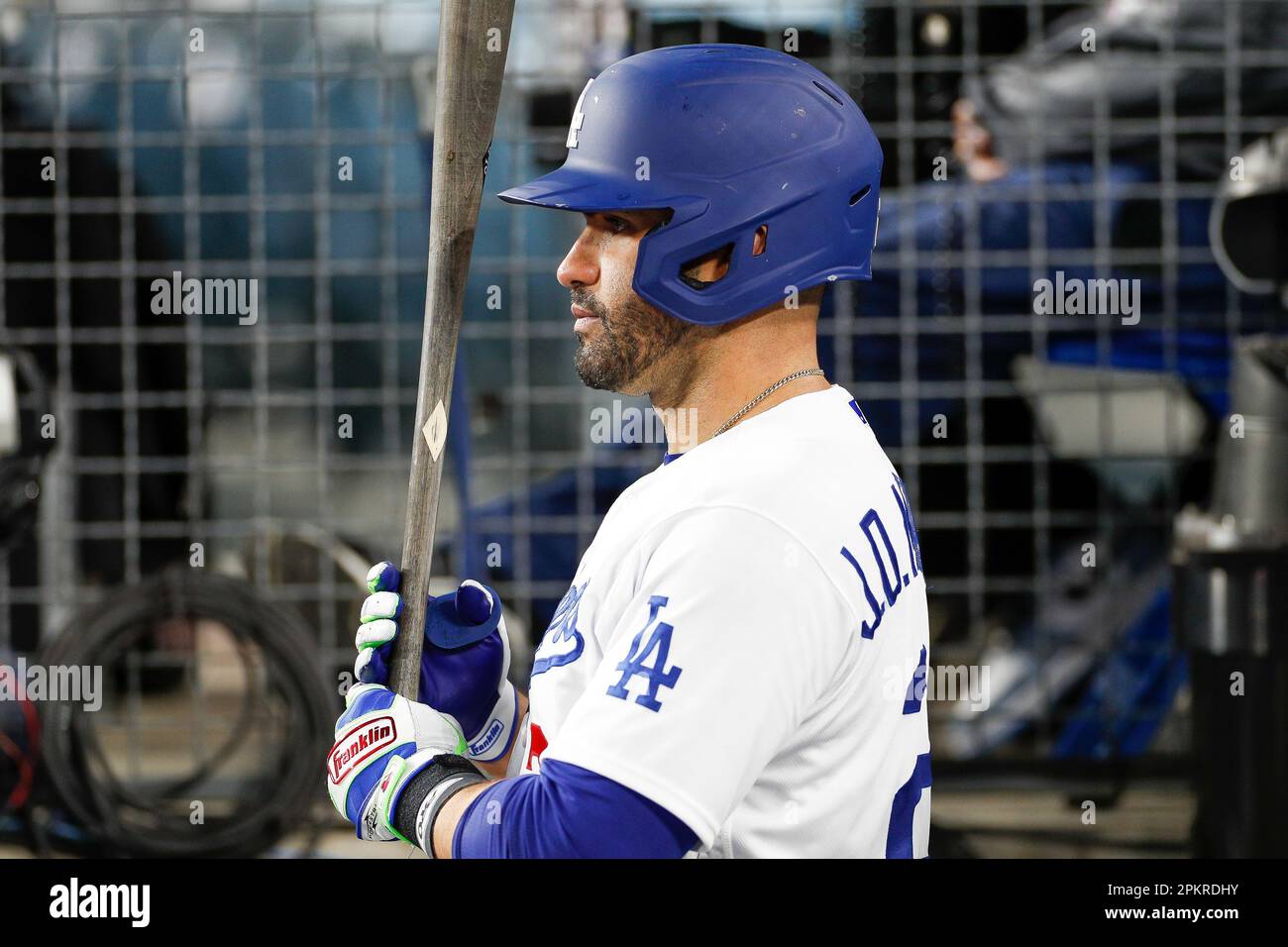 LOS ANGELES, CA - MARCH 31: Los Angeles Dodgers left fielder J.D. Martinez  (28) holds his bat in the dugout during a regular season game between the  Arizona Diamondbacks and Los Angeles