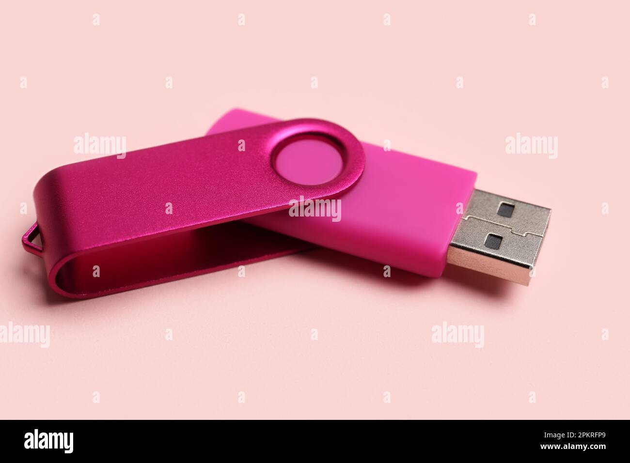 USB flash drive on pink background Stock Photo