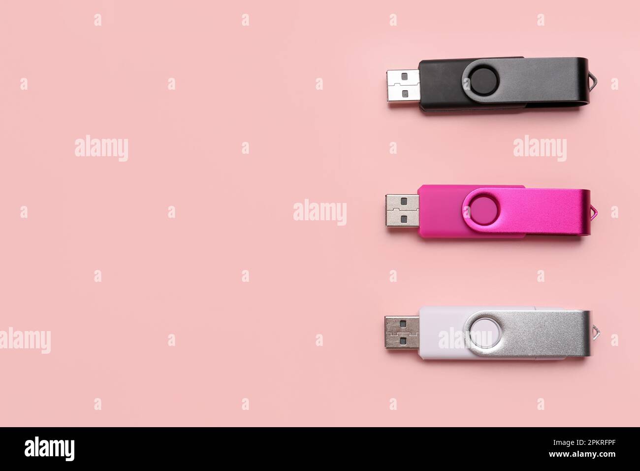 Set of USB flash drives on pink background Stock Photo Alamy