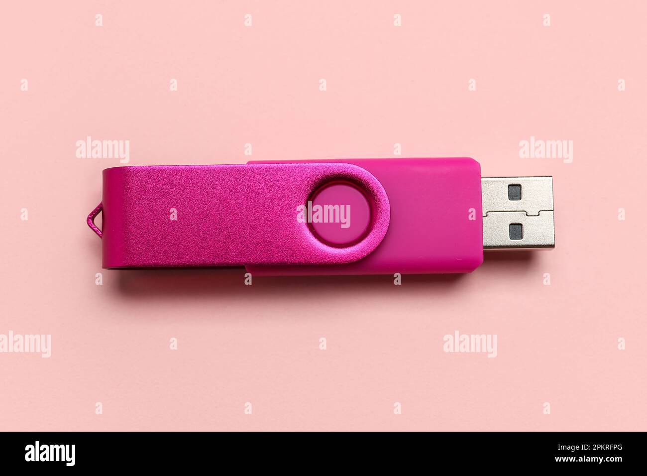 USB flash drive on pink background Stock Photo