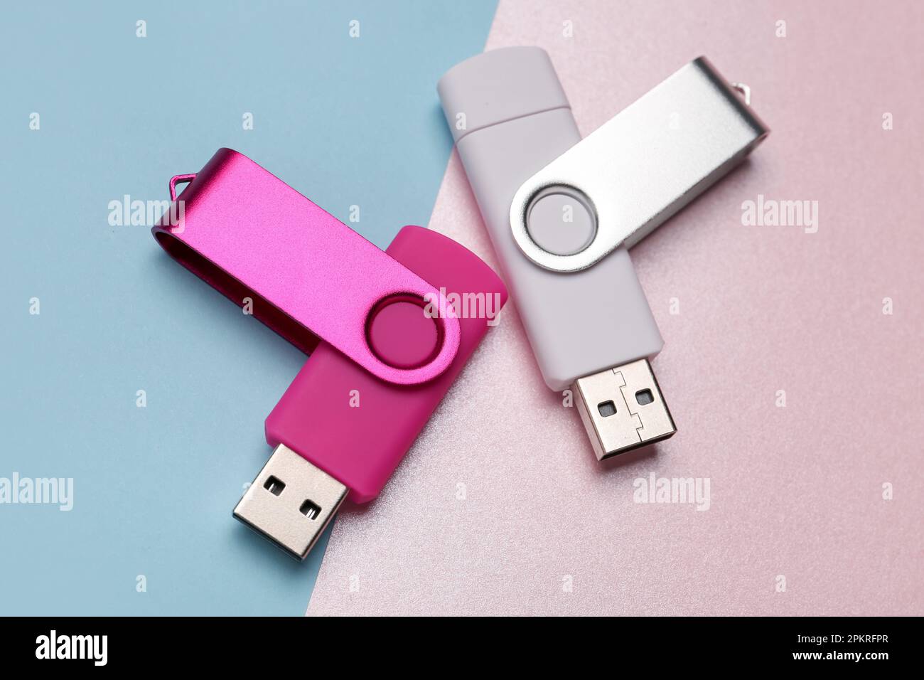 Two USB flash drives on color background Stock Photo