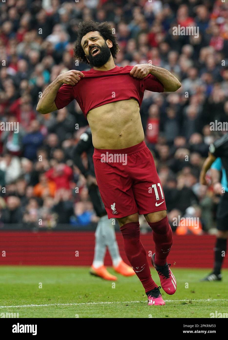 Liverpool's Mohamed Salah reacts after missing with his penalty during the Premier League match at Anfield, Liverpool. Picture date: Sunday April 9, 2023. Stock Photo