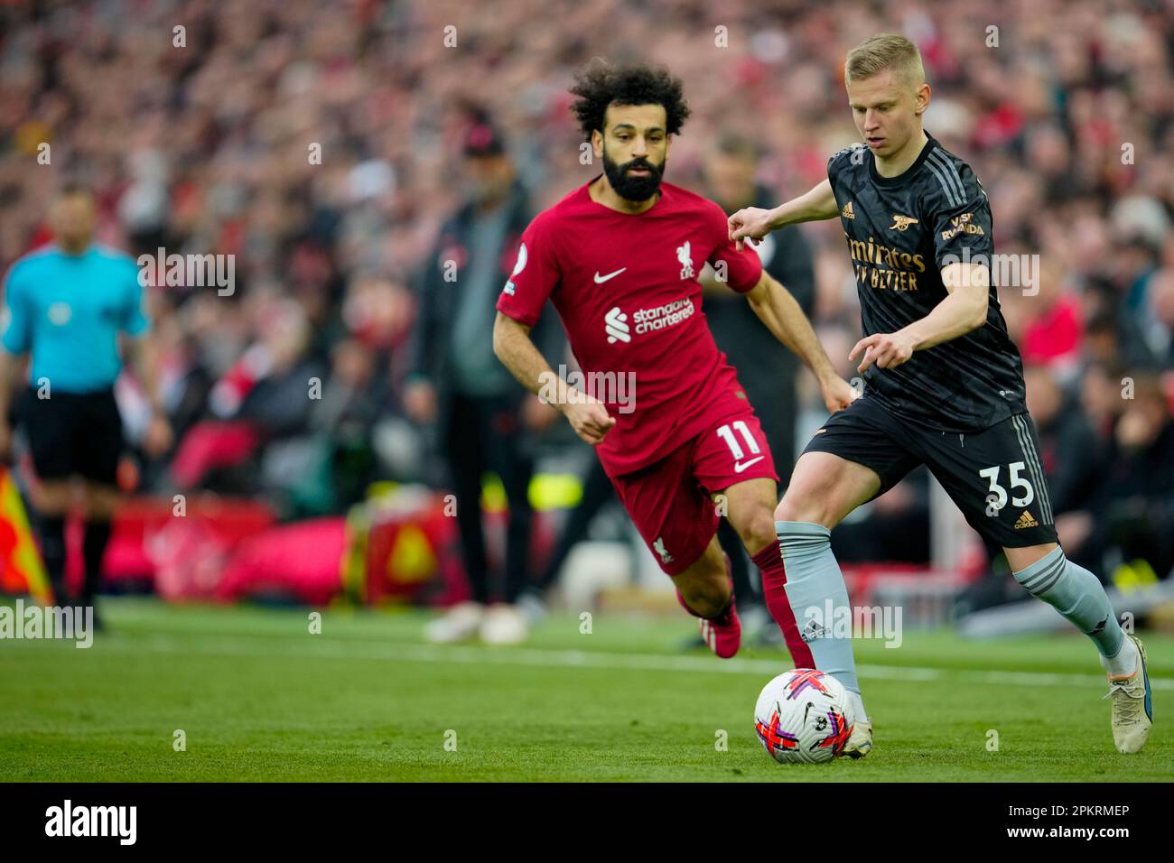 Arsenal's Oleksandr Zinchenko, right, duels for the ball with Liverpool