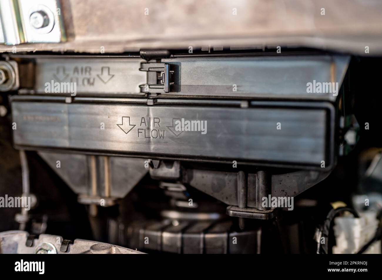 Automotive cabin air filter direction of flow arrow marked on casing