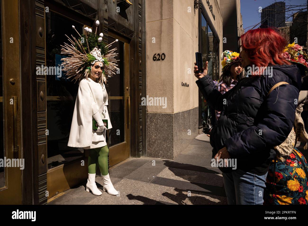 A person in costume poses for picture during the annual Easter Parade