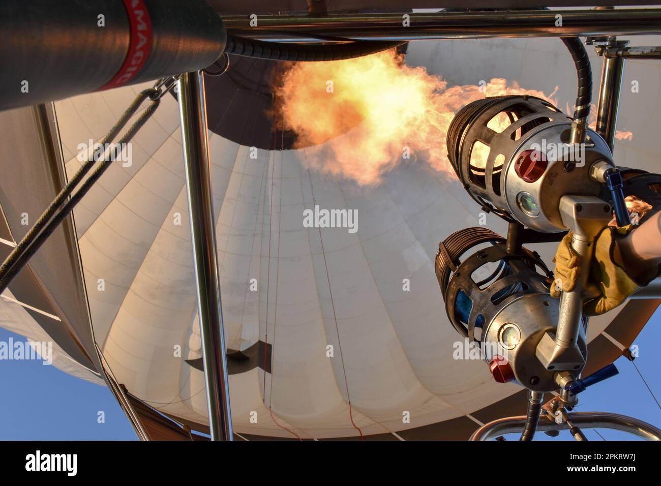 Inside a hot air balloon while burner heats and lifts the balloon Stock