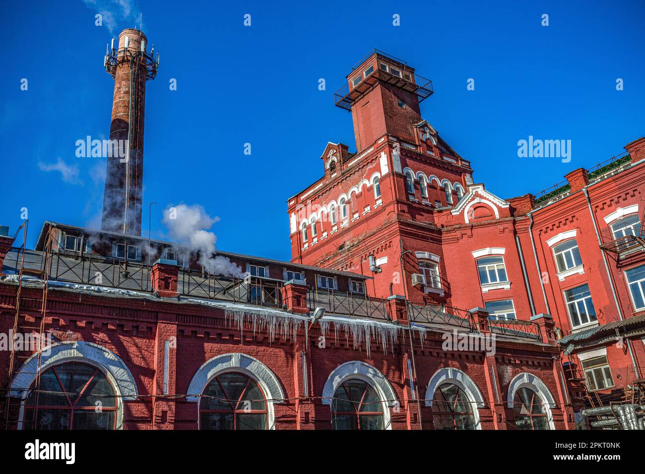 Industrial buildings and chimneys of an old red brick factory in Moscow ...