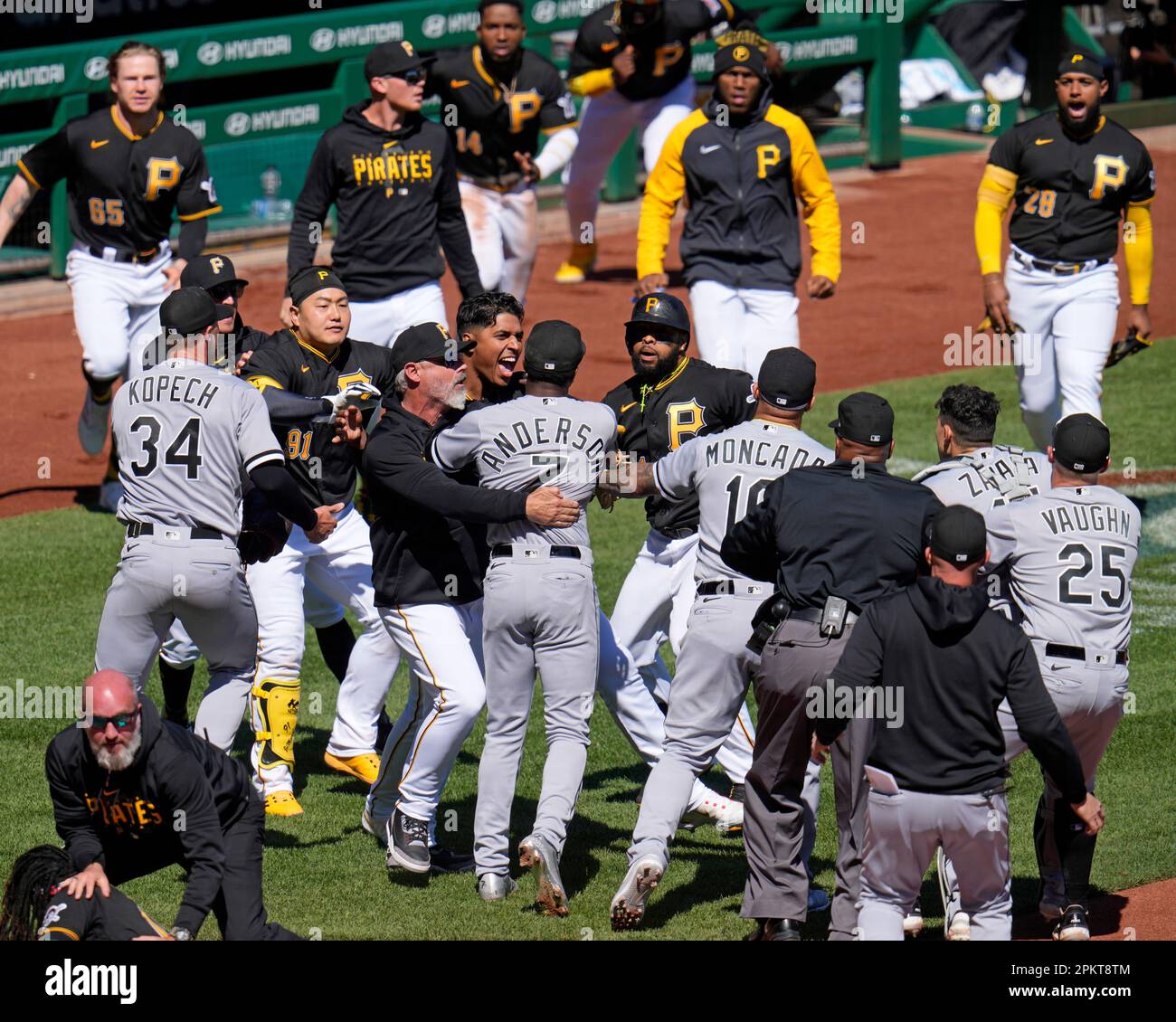 The benches clear as a result of a home plate collision between