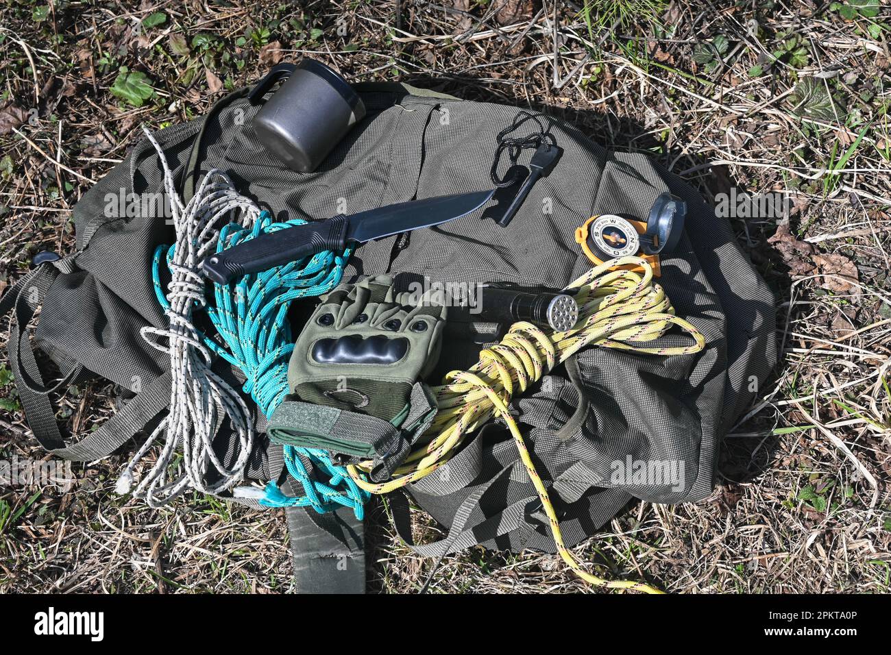Bushcraft equipment. Knife and rope lit by the sun Stock Photo Alamy