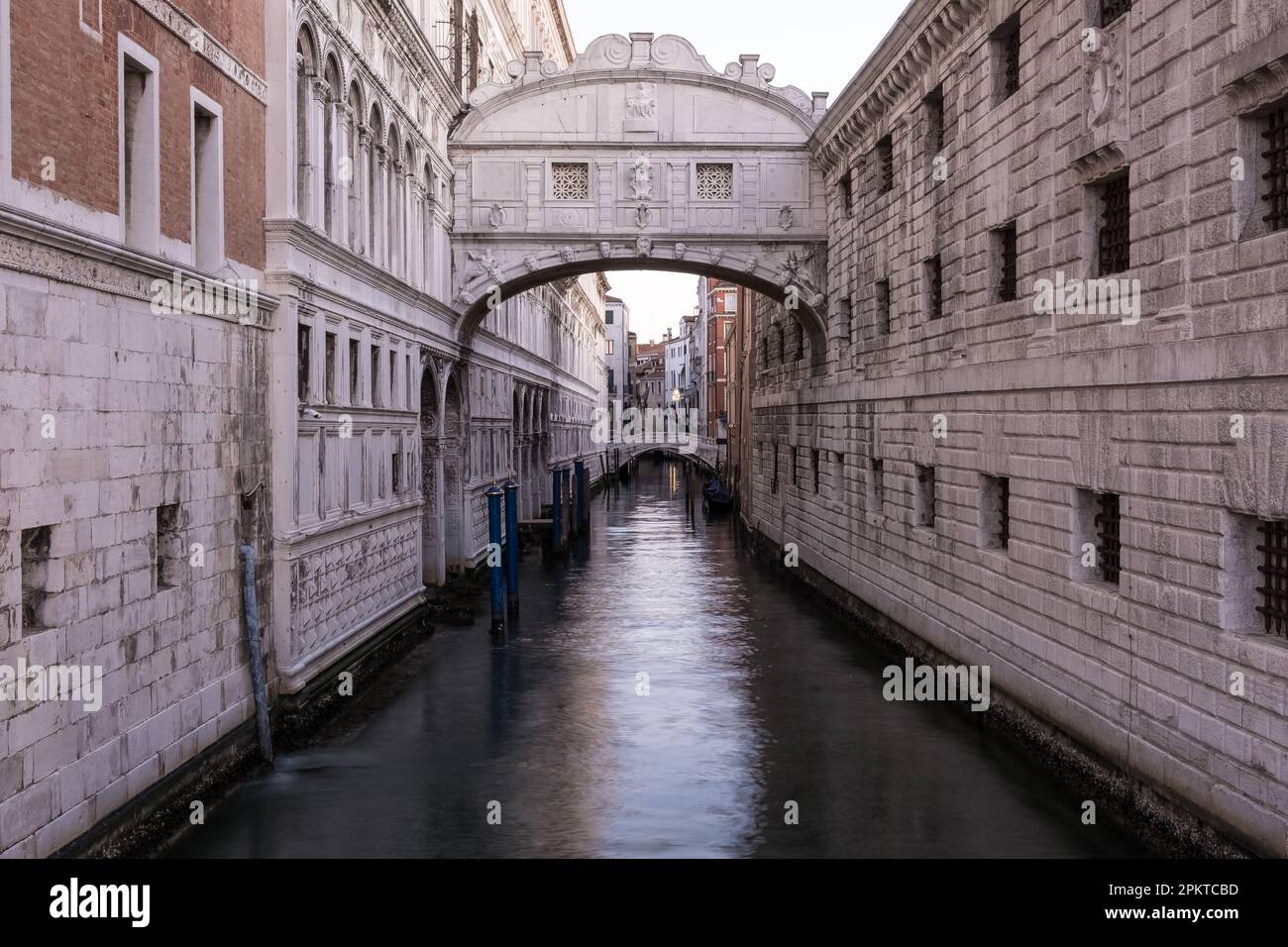View of the Bridge of Sighs, an enclosed bridge made of white limestone and windows with stone bars, passing over the Rio di Palazzo in Venice, Italy Stock Photo