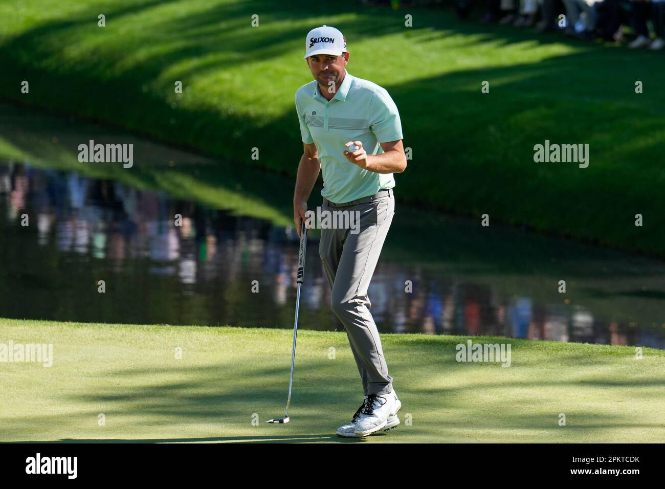 Keegan Bradley waves after his putt on the 16th hole during the final