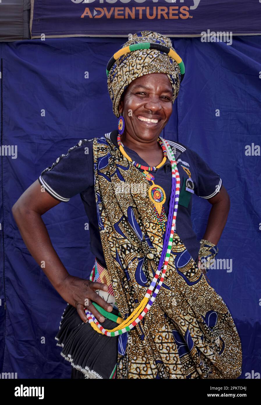 Patricia Nkuna, a Shangaan from Tzaneen; poses in front of her stall during the Haenertsburg Spring Festival in September. Stock Photo