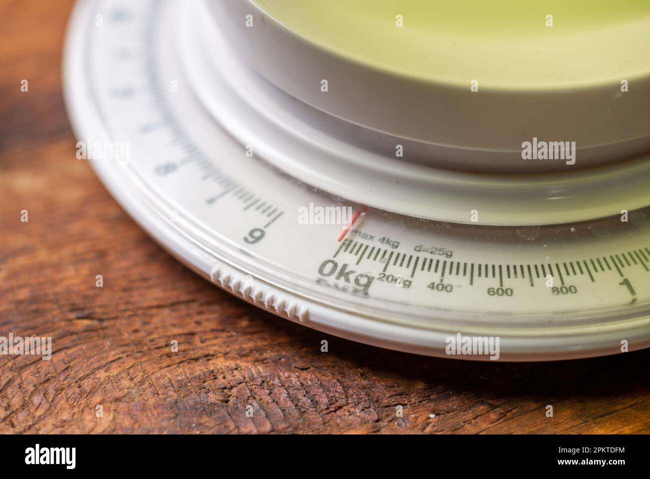 mechanical kitchen scales on wooden background. Measurement of weight