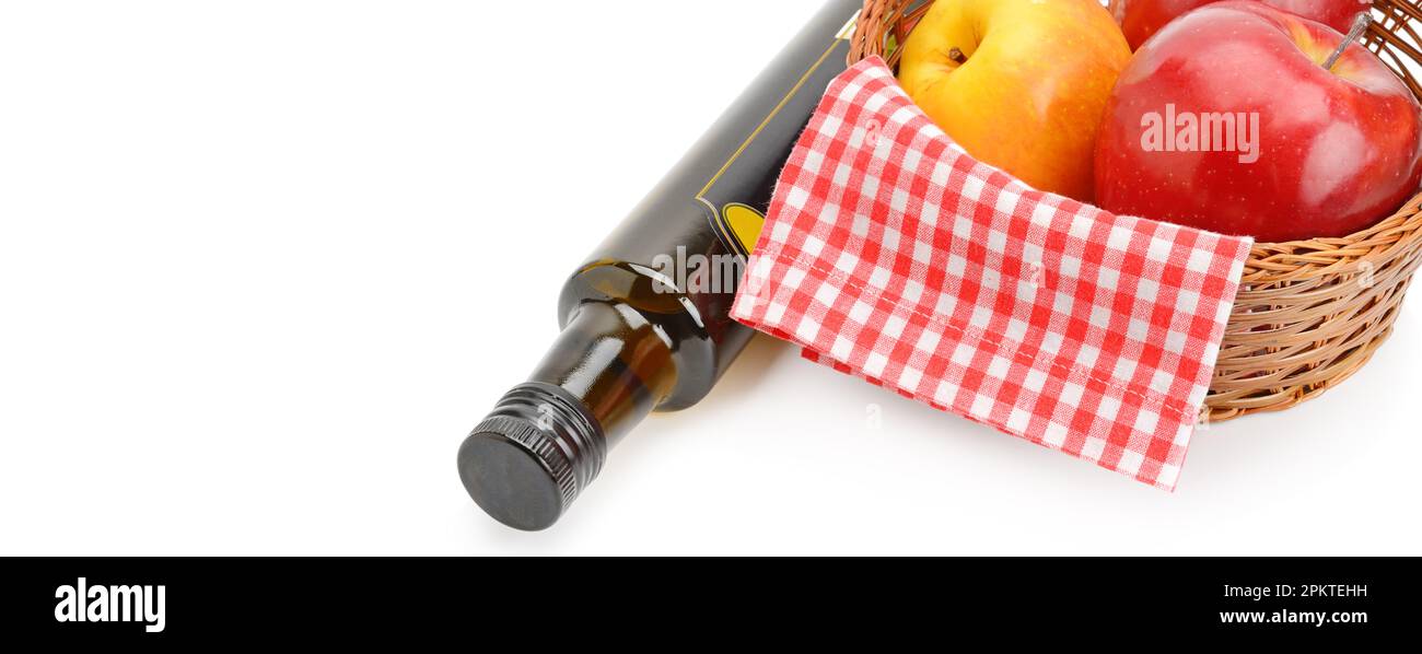 Apple cider vinegar in a bottle and ripe apples isolated on white ...