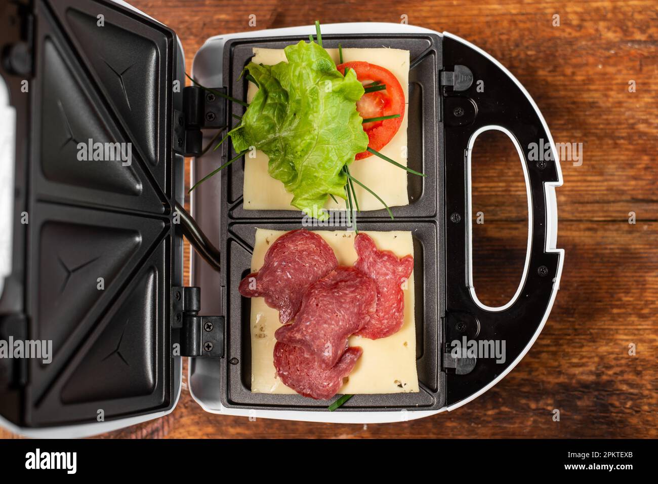 Vegetarian and meat sandwich in a sandwich maker. Different types of