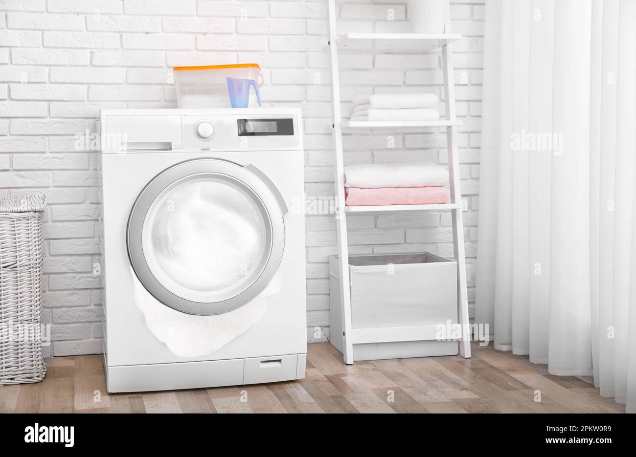 Foam coming out from broken washing machine during laundering in room