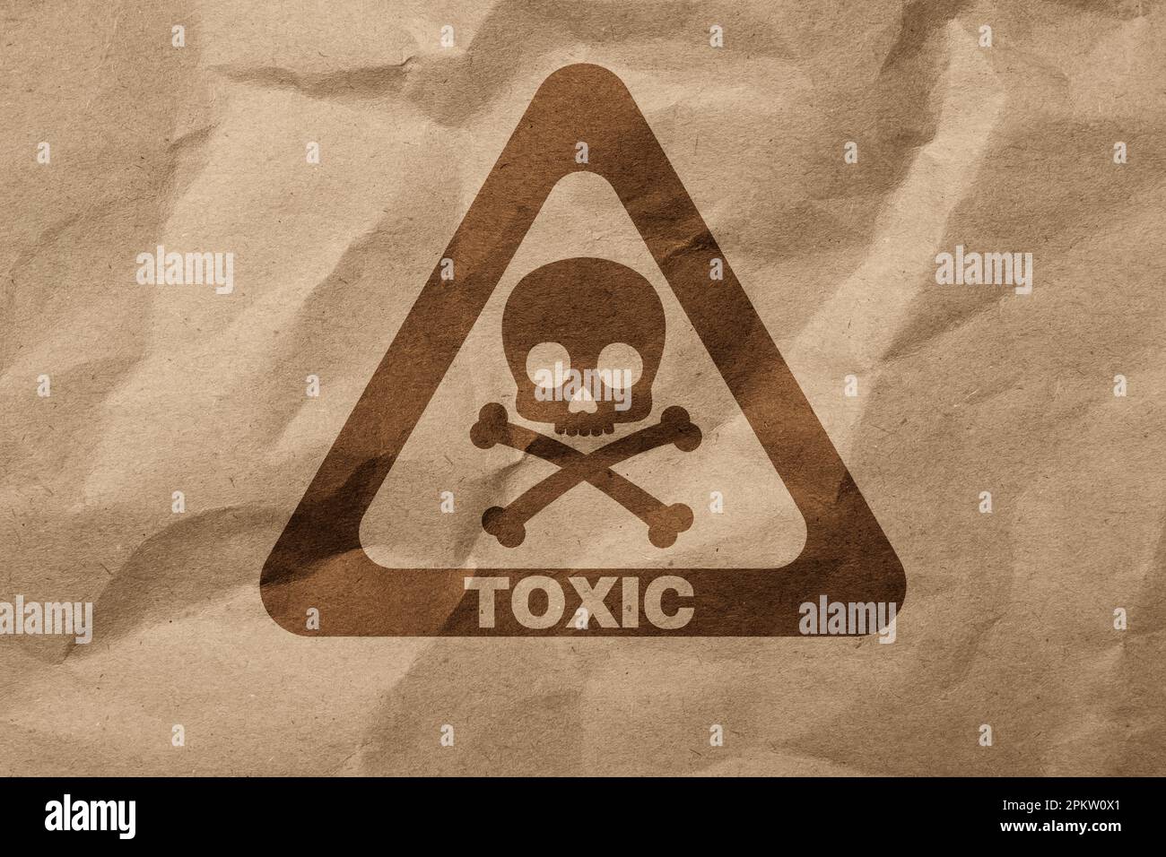 Hazard warning sign (skullandcrossbones symbol and word TOXIC) on