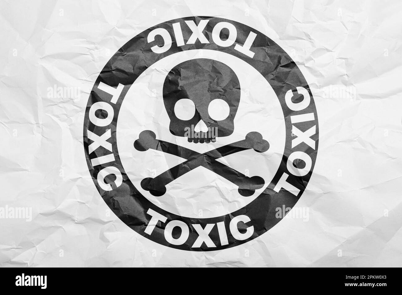 Hazard warning sign (skull-and-crossbones symbol and word TOXIC) on