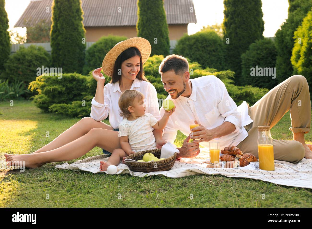 Happy family having picnic in garden on sunny day Stock Photo - Alamy