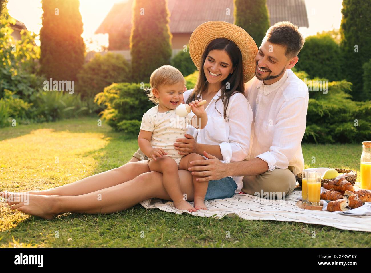 Happy family having picnic in garden on sunny day Stock Photo - Alamy