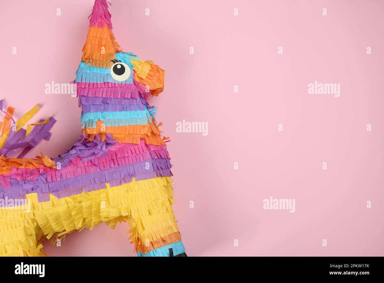 Bright donkey pinata on pink background, top view. Space for text Stock ...