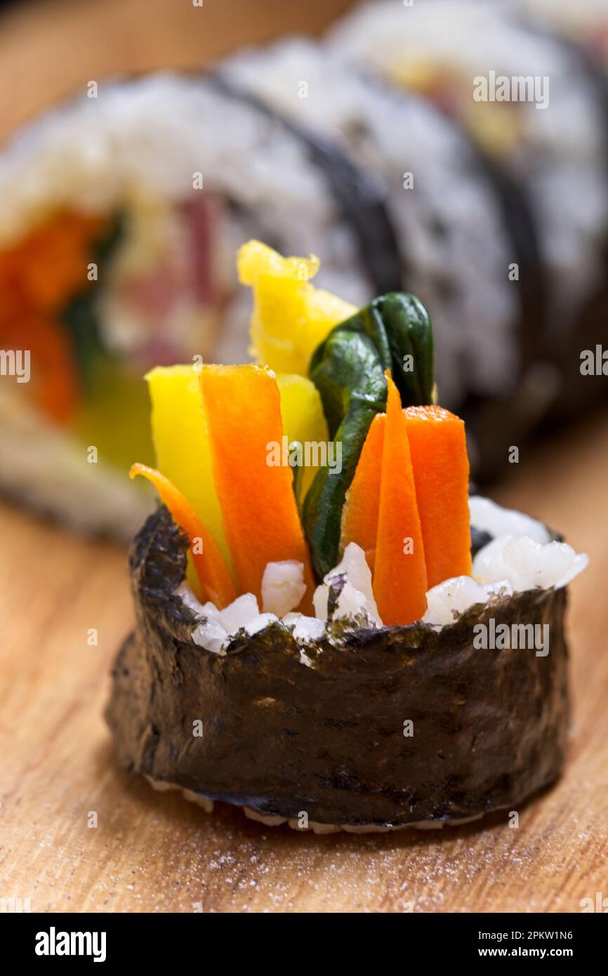 A close up of the end piece of a Korean treat called Kimbap. Food made with steamed rice