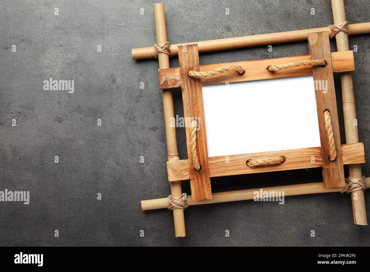 Empty bamboo frame on grey table, top view. Space for text Stock Photo ...